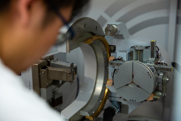 A scientist uses equipment in the Physics Department at Georgetown