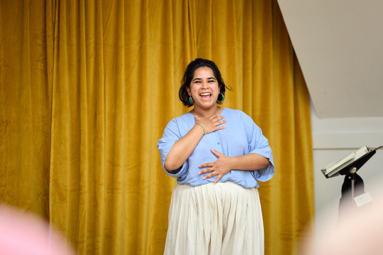 Georgetown alumna smiling on stage