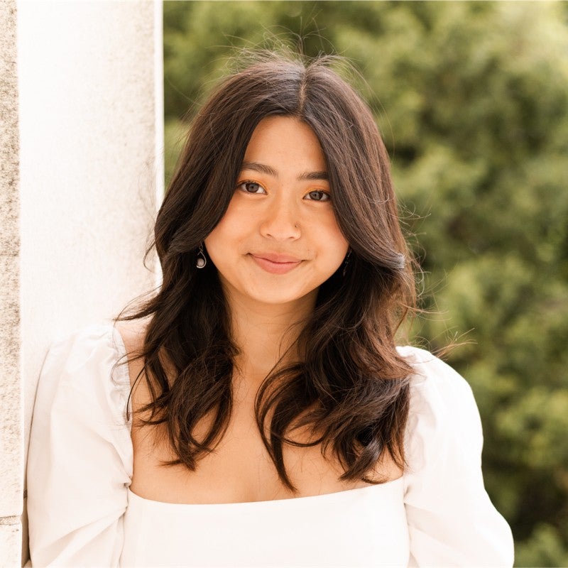 Anya Wahal in a portrait photo with a blurry outdoor background
